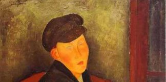 Siedzący chłopak w czapce